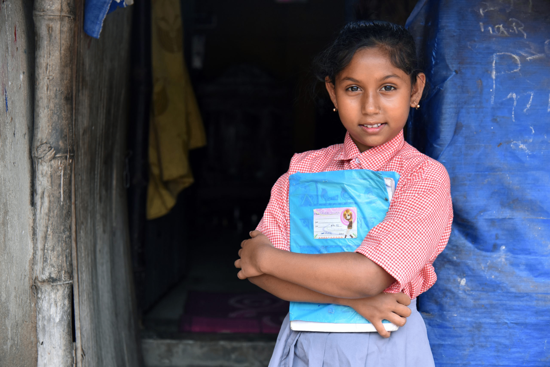 Young learner holding her school book